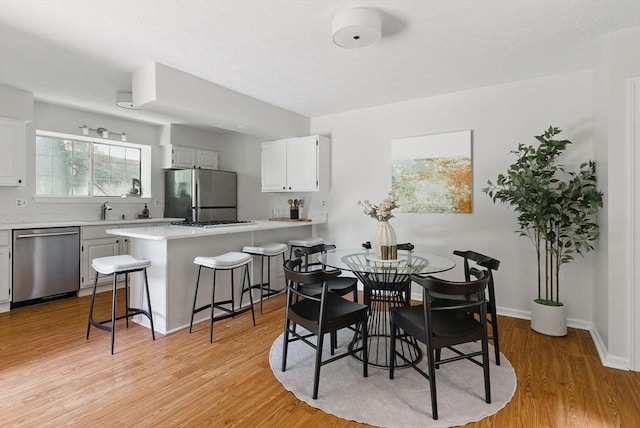 87 E Bluff Rd Unit 87, Ashland, MA 01721 - dining room featuring light wood-style flooring