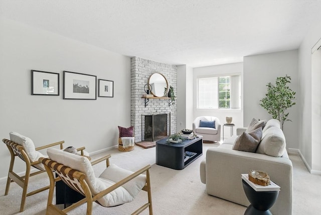 87 E Bluff Rd Unit 87, Ashland, MA 01721 - living area featuring light carpet, a brick fireplace, and baseboards