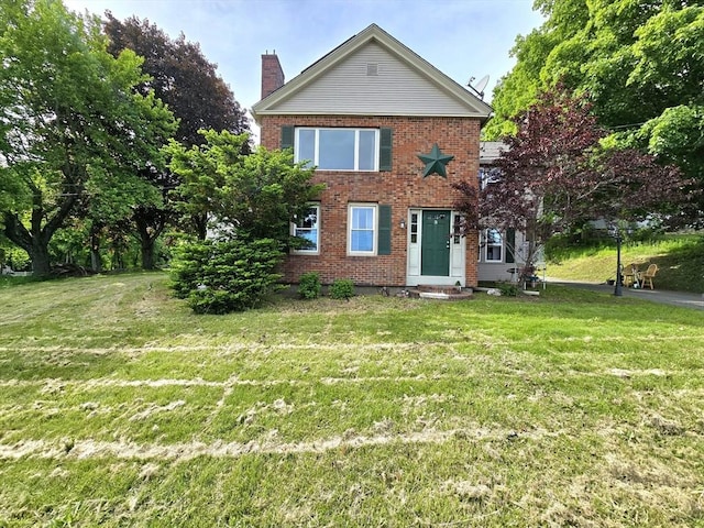 3 Main St, Spencer, MA 01562 - view of front of home featuring brick siding, a chimney, and a front yard