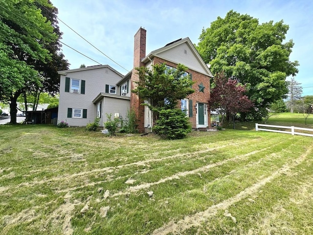 3 Main St, Spencer, MA 01562 - view of property exterior featuring brick siding and a chimney