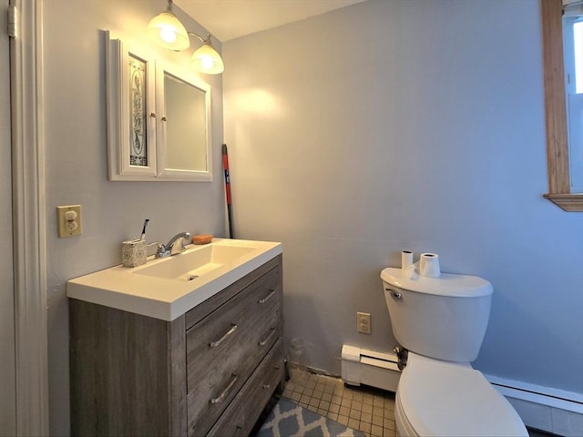 3 Main St, Spencer, MA 01562 - bathroom featuring a baseboard radiator, toilet, vanity, and tile patterned flooring