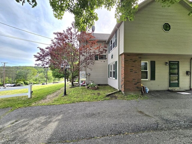 3 Main St, Spencer, MA 01562 - view of side of home with brick siding and a yard