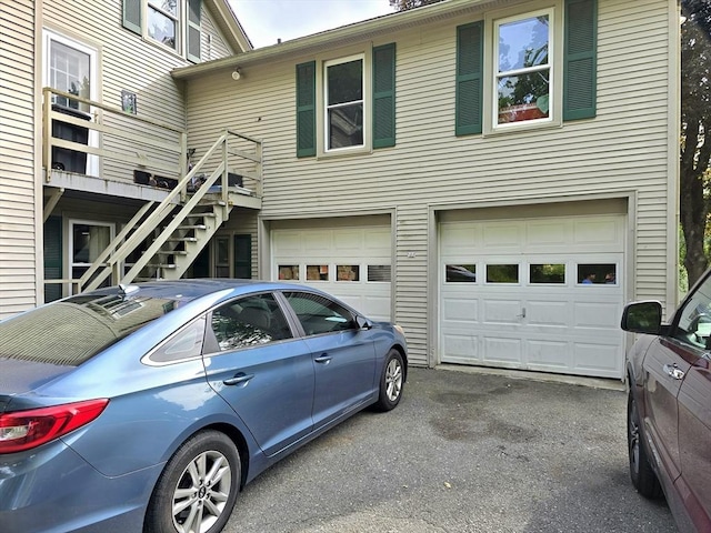 3 Main St, Spencer, MA 01562 - view of front facade with an attached garage and driveway