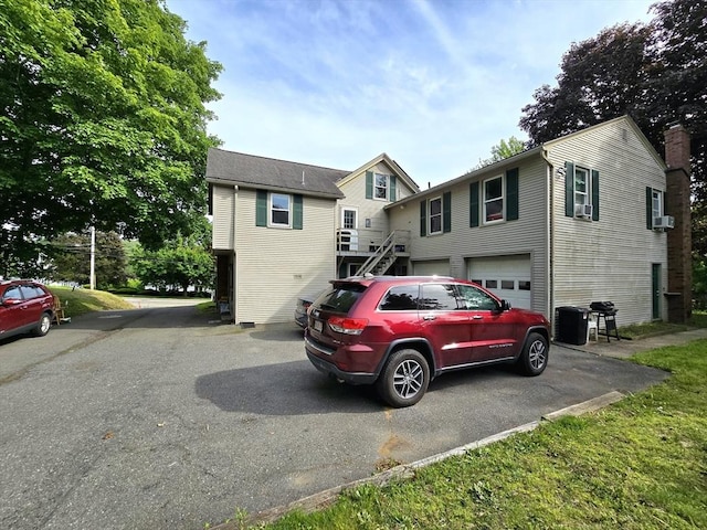 3 Main St, Spencer, MA 01562 - view of front facade featuring asphalt driveway, a garage, and stairs
