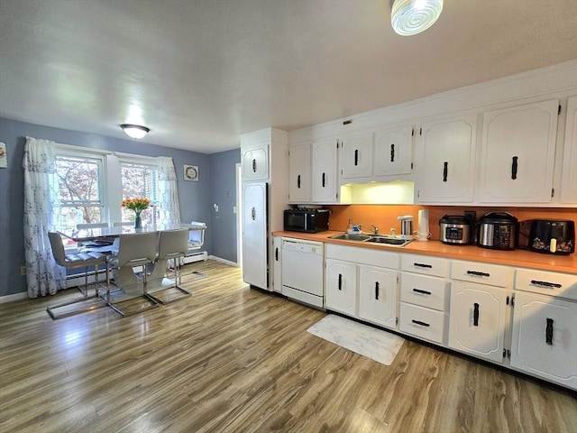 3 Main St, Spencer, MA 01562 - kitchen featuring dishwasher, a sink, fridge, black microwave, and white cabinetry
