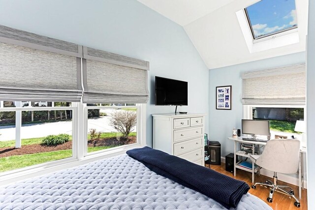 24 Park St, Bourne, MA 02559 - bedroom with wood finished floors and vaulted ceiling with skylight