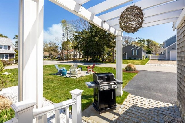 24 Park St, Bourne, MA 02559 - view of patio / terrace featuring grilling area and a residential view