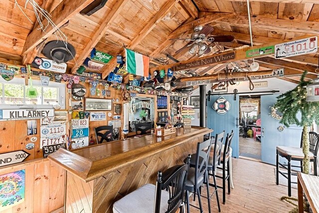 24 Park St, Bourne, MA 02559 - bar with wooden ceiling, bar, vaulted ceiling with beams, and wood-type flooring