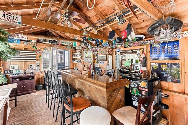 24 Park St, Bourne, MA 02559 - bar featuring hardwood / wood-style floors, wood ceiling, a ceiling fan, vaulted ceiling with beams, and a bar