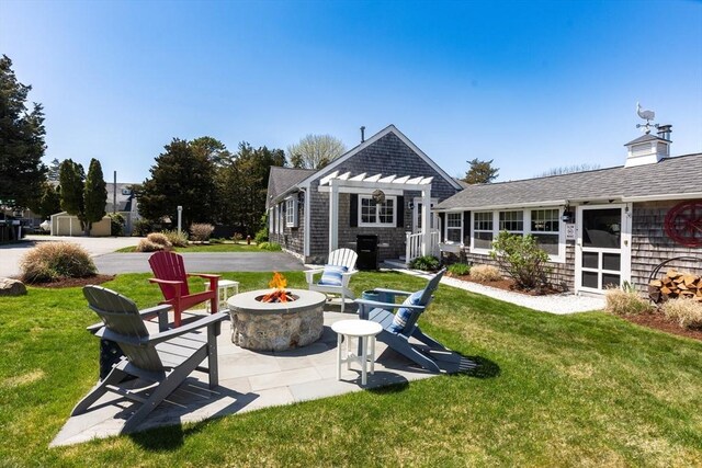 24 Park St, Bourne, MA 02559 - back of house with a yard, a pergola, a fire pit, and a patio area