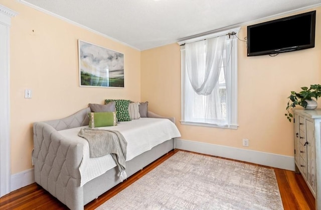 bedroom with wood-type flooring