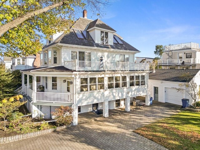 view of front of house with a balcony and a porch