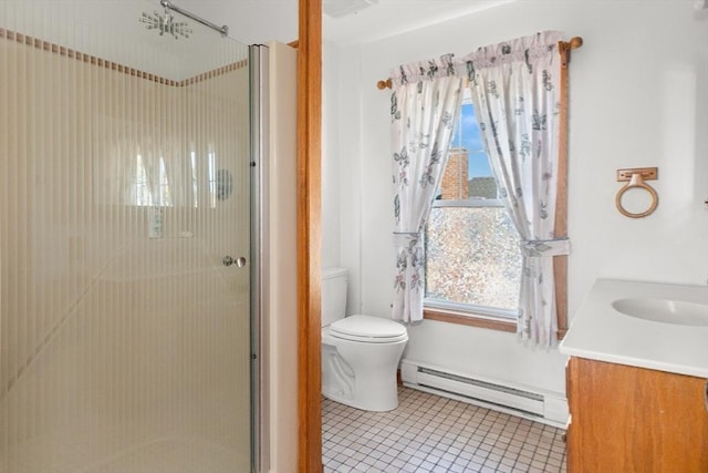 bathroom with a baseboard heating unit, vanity, tile patterned floors, toilet, and walk in shower