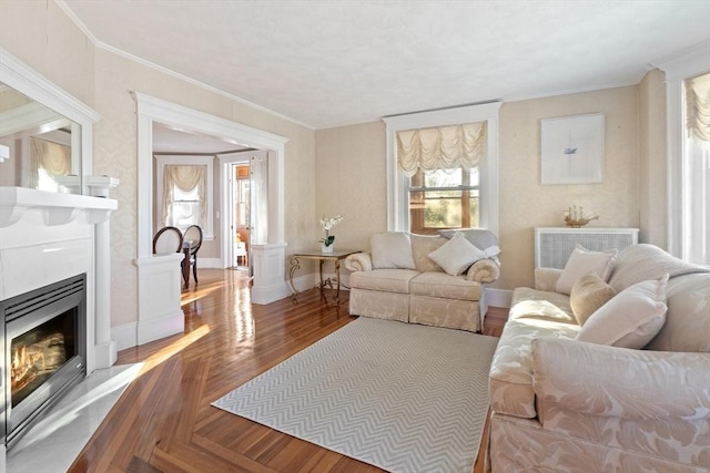 living room with ornamental molding and hardwood / wood-style floors