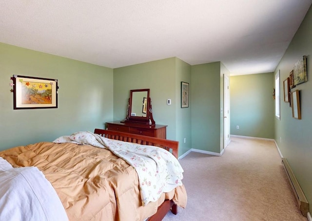 bedroom featuring carpet floors, baseboards, and baseboard heating