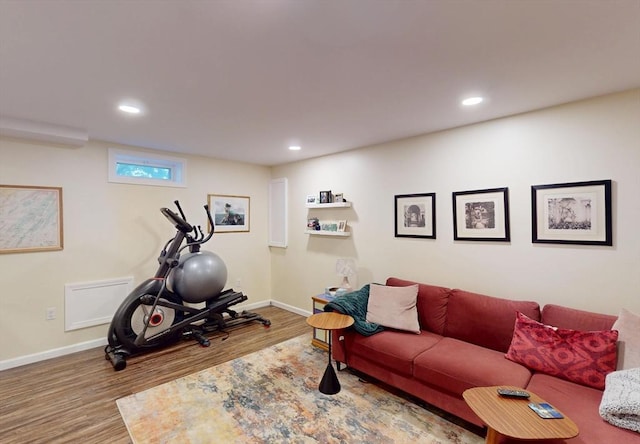 living room with baseboards, recessed lighting, and wood finished floors