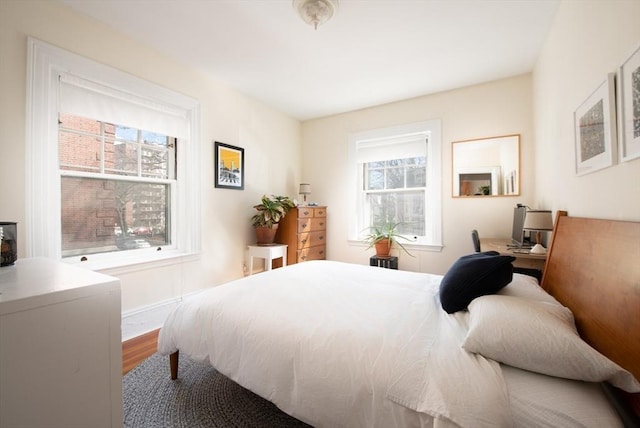 bedroom featuring wood finished floors