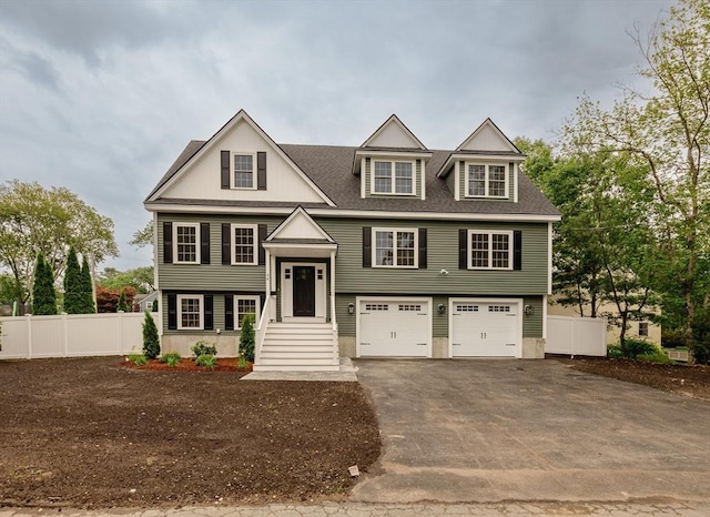34 Torre St, Reading, MA 01867 - raised ranch with driveway, a garage, and a shingled roof