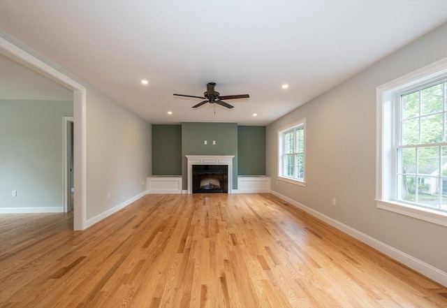 34 Torre St, Reading, MA 01867 - unfurnished living room featuring ceiling fan, a fireplace, light wood-style flooring, and recessed lighting
