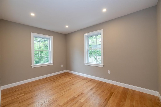 34 Torre St, Reading, MA 01867 - empty room with plenty of natural light, light wood finished floors, and recessed lighting