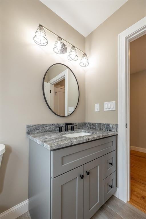 34 Torre St, Reading, MA 01867 - bathroom with vanity and wood finished floors