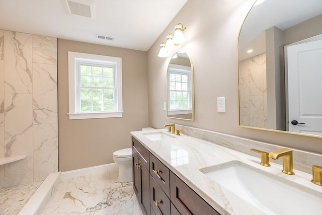 34 Torre St, Reading, MA 01867 - full bath featuring marble finish flooring, double vanity, and a marble finish shower