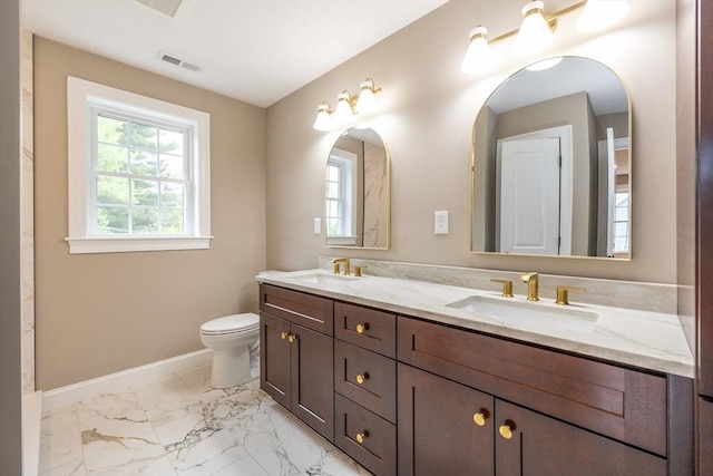 34 Torre St, Reading, MA 01867 - full bathroom featuring double vanity, healthy amount of natural light, and marble finish floors