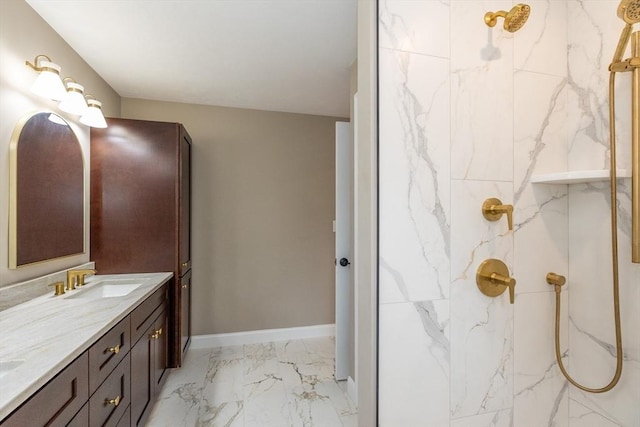 34 Torre St, Reading, MA 01867 - bathroom featuring marble look tile flooring, double vanity, and a marble finish shower