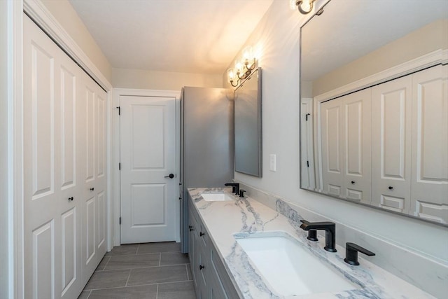 34 Torre St, Reading, MA 01867 - bathroom with double vanity and tile patterned flooring