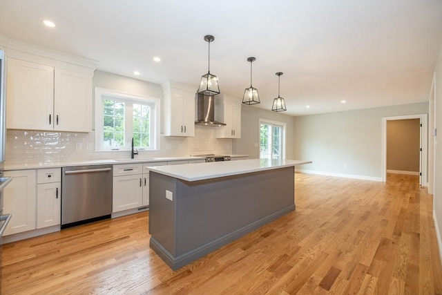 34 Torre St, Reading, MA 01867 - kitchen with dishwasher, decorative backsplash, healthy amount of natural light, light countertops, and recessed lighting
