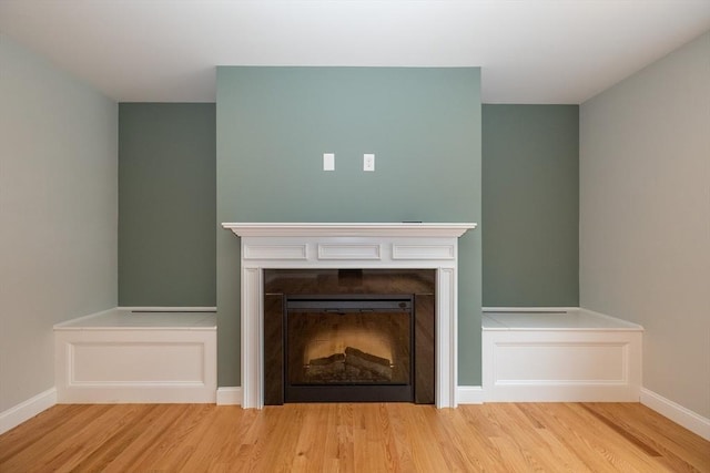 34 Torre St, Reading, MA 01867 - detailed view of wood finished floors and a fireplace