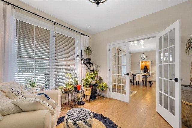 living area featuring hardwood / wood-style flooring and french doors