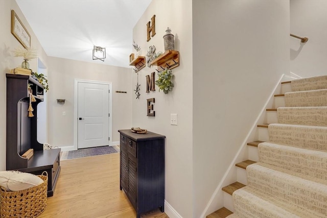 corridor with light hardwood / wood-style flooring