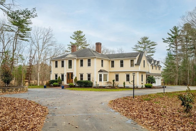 view of front facade with a chimney