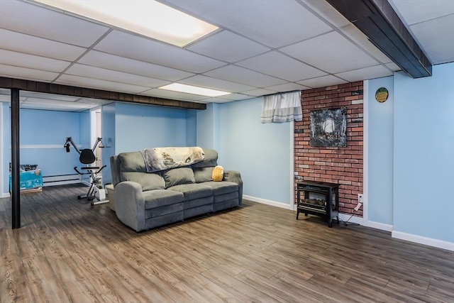 living room featuring baseboard heating, wood finished floors, and baseboards