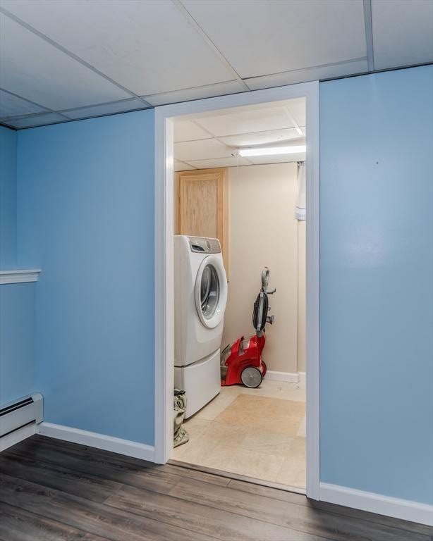 washroom with washer / dryer, baseboards, and wood finished floors