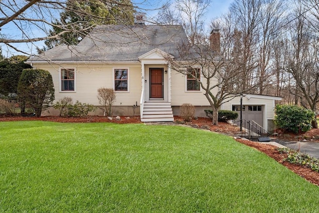 view of front facade featuring a garage and a front lawn