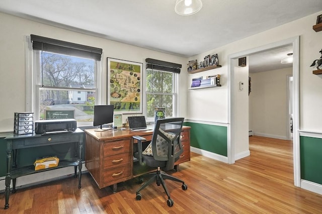 25 Cardigan Rd, Tewksbury, MA 01876 - home office featuring wood finished floors, baseboards, and a baseboard heating unit