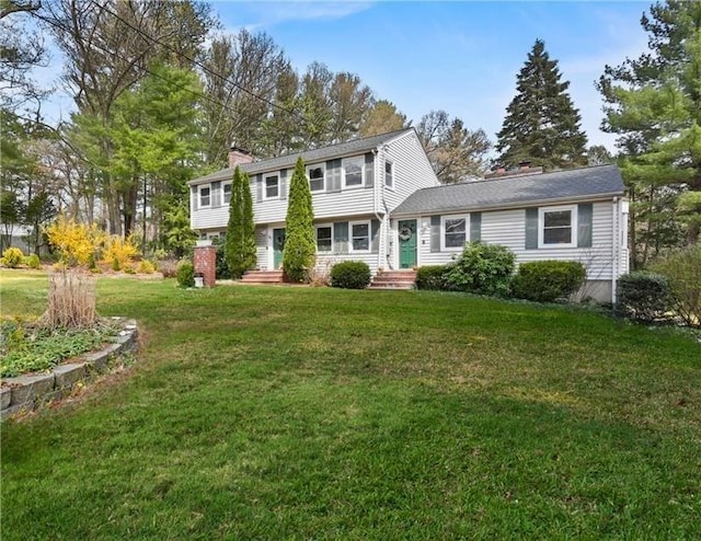 25 Cardigan Rd, Tewksbury, MA 01876 - colonial home featuring a chimney and a front yard