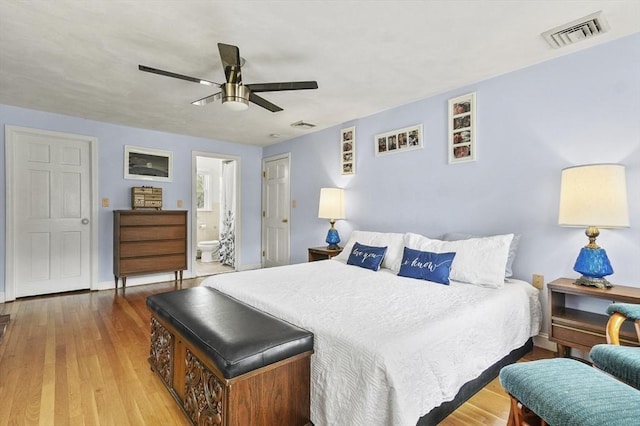 25 Cardigan Rd, Tewksbury, MA 01876 - bedroom with wood finished floors, ensuite bathroom, ceiling fan, and baseboards