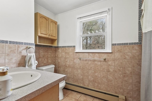 25 Cardigan Rd, Tewksbury, MA 01876 - bathroom featuring toilet, tile walls, a baseboard radiator, crown molding, and vanity
