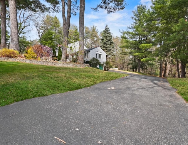 25 Cardigan Rd, Tewksbury, MA 01876 - view of front of home with a front lawn and driveway