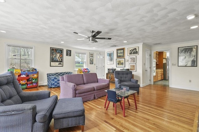 25 Cardigan Rd, Tewksbury, MA 01876 - living room with recessed lighting, healthy amount of natural light, light wood-style flooring, a ceiling fan, and baseboards