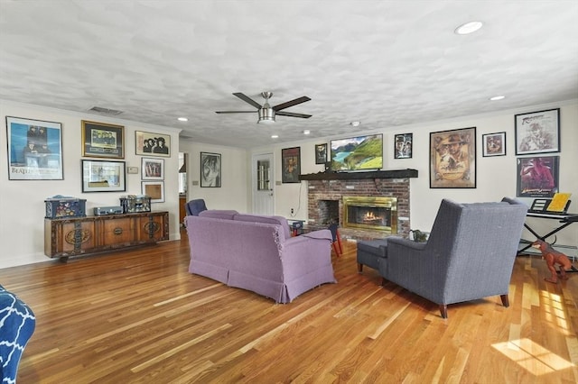25 Cardigan Rd, Tewksbury, MA 01876 - living room featuring a fireplace, wood finished floors, recessed lighting, ceiling fan, and ornamental molding