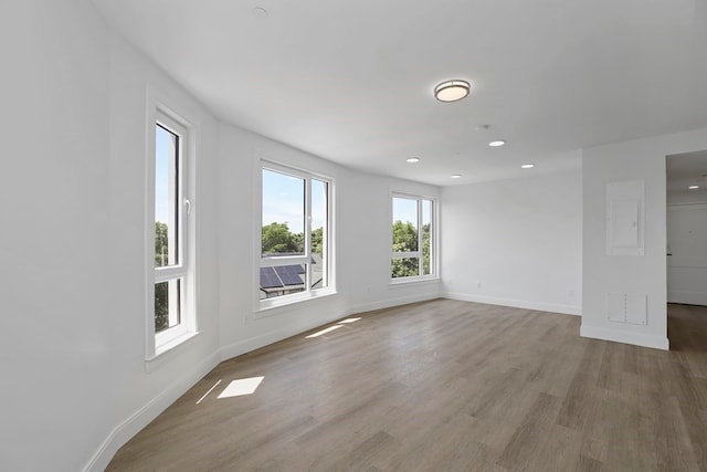 spare room with hardwood / wood-style floors