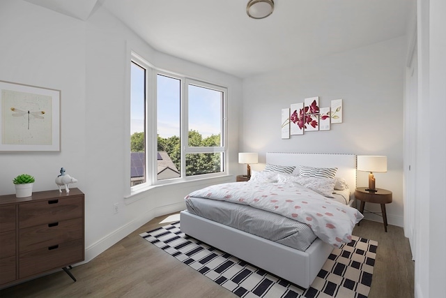 bedroom with hardwood / wood-style floors