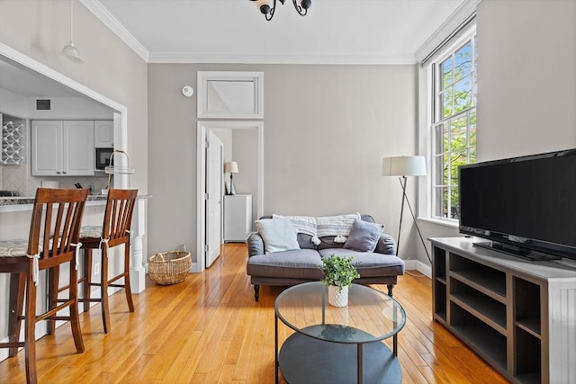 17 Bowdoin Unit 2B, Boston, MA 02114 - living area with light wood-style floors and ornamental molding