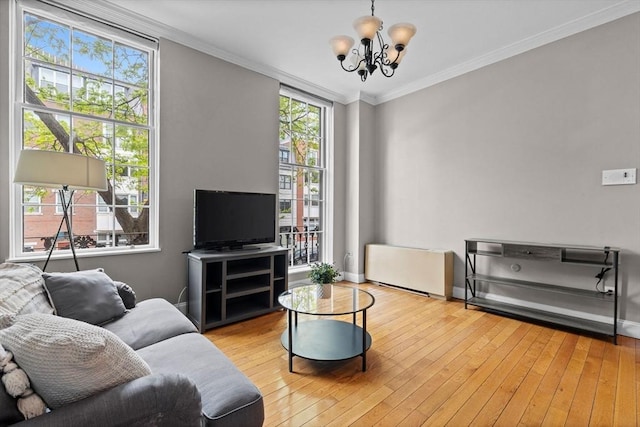 17 Bowdoin Unit 2B, Boston, MA 02114 - living room featuring a chandelier, hardwood / wood-style flooring, ornamental molding, and baseboards
