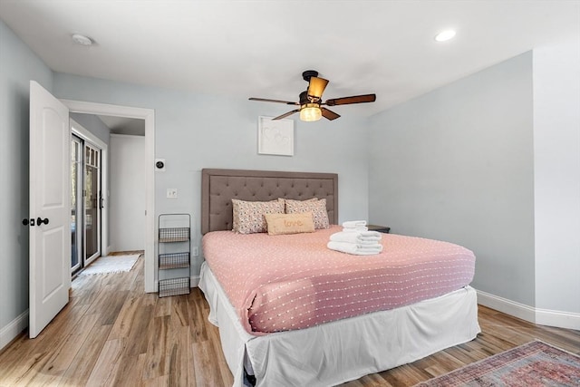 bedroom featuring ceiling fan and light hardwood / wood-style floors