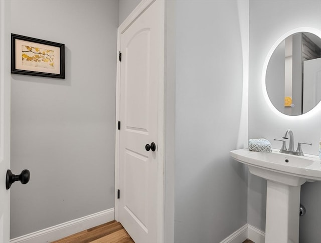 bathroom with sink and hardwood / wood-style flooring